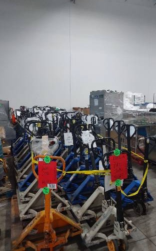 Condition photo showing As Is for pallet jacks 